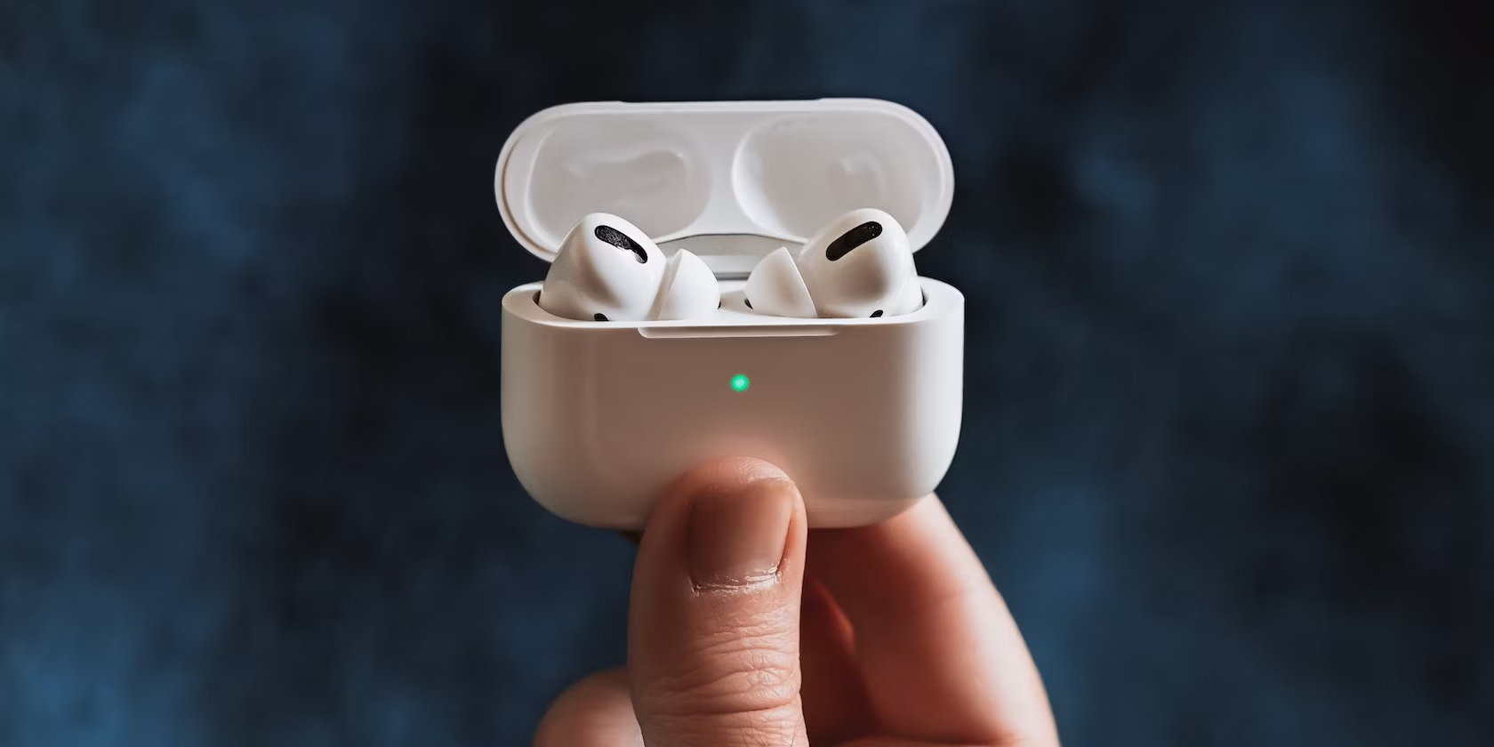 Person-holding-AirPods-Pro-featured