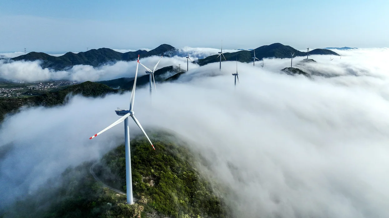 wind-turbines-on-a-hillside-shrouded-in-fog
